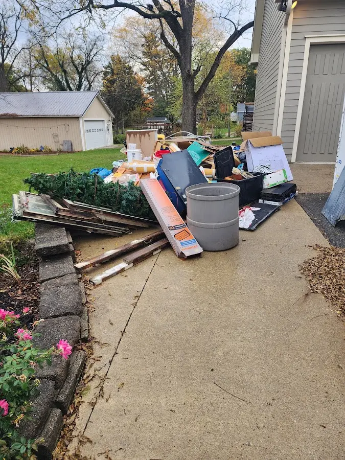 Dumpster being loaded with debris for 3 Yard Dumpster Rental in Walden